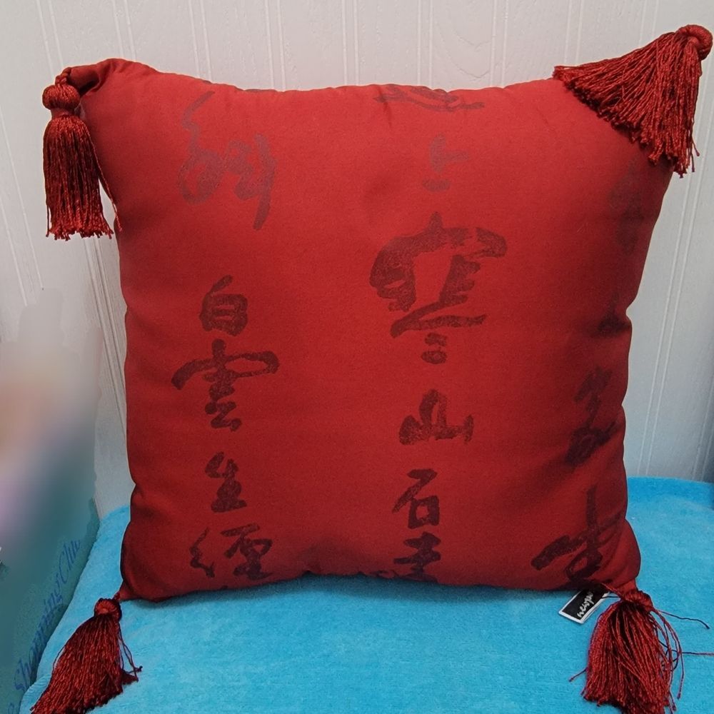 Red Pillow with Tassels and Black Script
